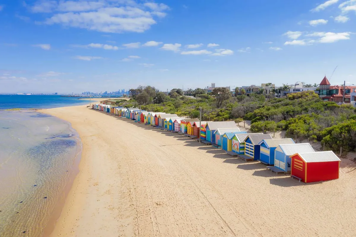 aerial-view-of-brighton-bathing-boxes-on-white-sandy-beach-at-brighton-beach-in-melbourne--victoria--australia--1134480493-4ebbe192a17144cfa8f82eac988da916