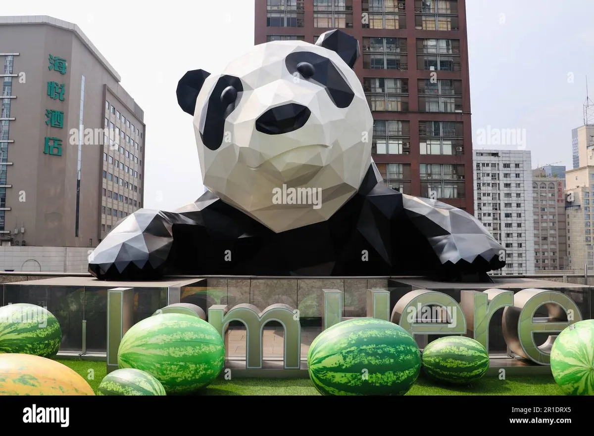 a-sculpture-of-a-panda-climbing-on-a-building-in-chengdu-china-2R1DRX5