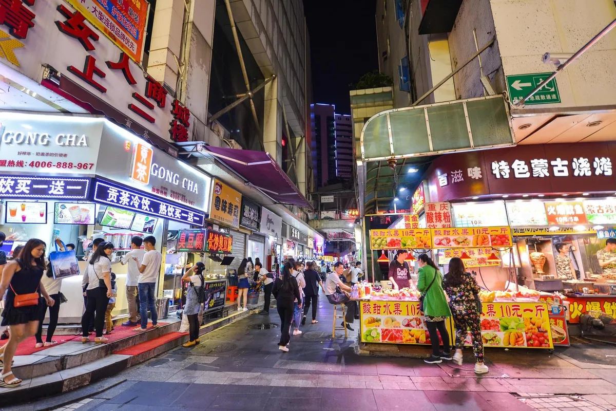 shenzhen-china-apr-08-2017-shoppers-and-visitors-crowd-the-famous-dongmen-pedestrian-street-dongmen-is-a-shopping-area-and-subdistrict-within-luohu-district-of-shenzhen-