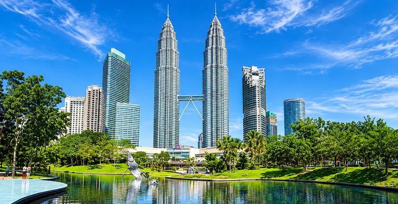 Petronas Towers Over the Urban Park.png