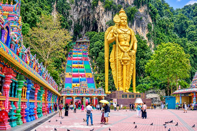 Batu Caves Rainbow Stairway and Golden Murugan.png